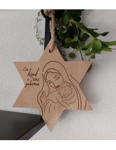 Kerstster Een kind is ons...